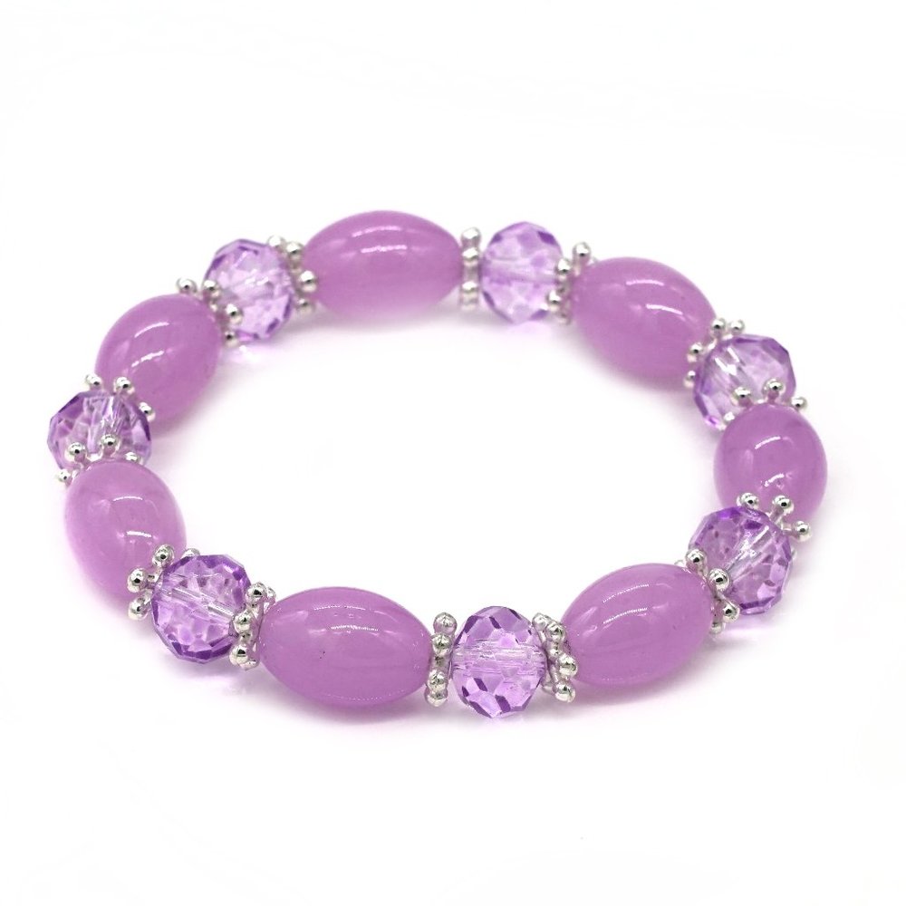 Bracelet with purple glass beads and silver spacers.
